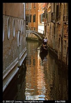 Gondola and reflexions in a narrow canal
