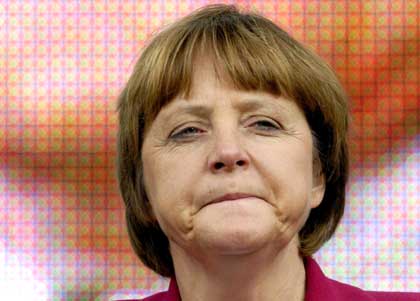 angela merkel pimasz diáklány arccal