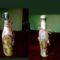 "Mucha" képpel díszített üveg és egy vintage üveg