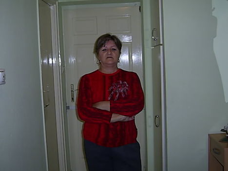 A woman is in front of the door.