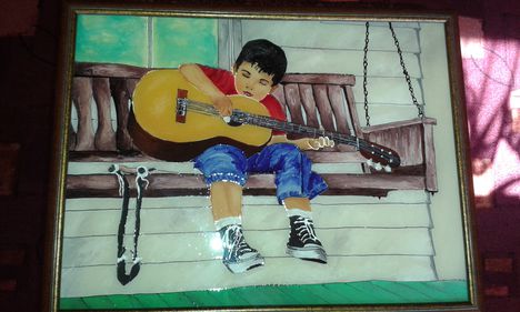 kisfiú a gitárral