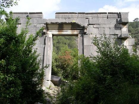 The gigantic remains of a Hellenistic temple lie hidden in the forest at Olympos