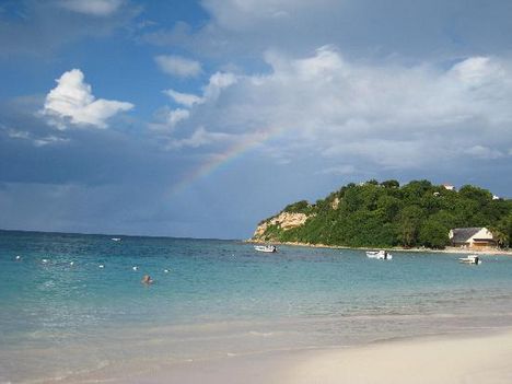 view-of-beach-with-rainbow
