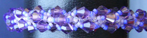lila swarovski csavart karkoto