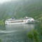 kiránduló hajó a fjordon