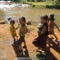 07 Lao children walking along the creek
