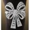 1241349863_thumb_antique-platinum-bowtie-with-white-swarovski-crystals-napkin-ring-set-4-